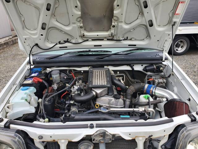 ジムニー FISフリースタイルワールドカップリミテッド インタークーラーターボ リフトアップ 社外マフラー バンパー バンパーガード ターボタイマー ウッド調パネル 4WD オートマ車(12枚目)