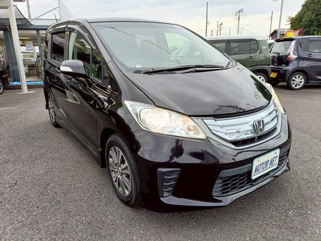 フリードハイブリッド ジャストセレクション　ＨＤＤナビ　両側電動スライドドア　Ｂｌｕｅｔｏｏｔｈオーディオ　クルーズコントロール　ＥＴＣ　フルセグＴＶ　音楽録音　ウォークスルー　３列シート　純正アルミ　ＣＤ／ＤＶＤ再生　ハーフレザーシート（20枚目）