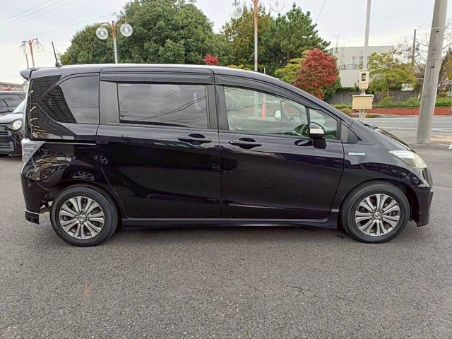 フリードハイブリッド ジャストセレクション　ＨＤＤナビ　両側電動スライドドア　Ｂｌｕｅｔｏｏｔｈオーディオ　クルーズコントロール　ＥＴＣ　フルセグＴＶ　音楽録音　ウォークスルー　３列シート　純正アルミ　ＣＤ／ＤＶＤ再生　ハーフレザーシート（34枚目）