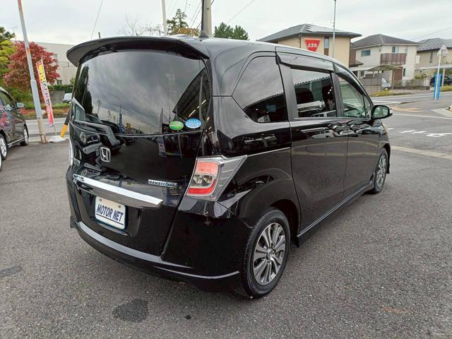 フリードハイブリッド ジャストセレクション　ＨＤＤナビ　両側電動スライドドア　Ｂｌｕｅｔｏｏｔｈオーディオ　クルーズコントロール　ＥＴＣ　フルセグＴＶ　音楽録音　ウォークスルー　３列シート　純正アルミ　ＣＤ／ＤＶＤ再生　ハーフレザーシート（35枚目）