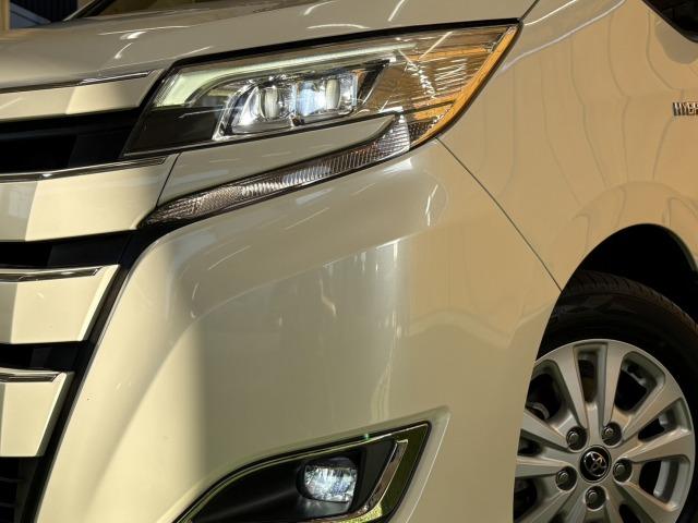 ノア ハイブリッドＧ　９型ナビ　後席モニター　クルーズコントロール　後席オートエアコン　衝突軽減　レーンキープ　両側電動スライドドア　オートマチックハイビーム　シートヒーター　バックカメラ　地デジ　プッシュスタート（76枚目）