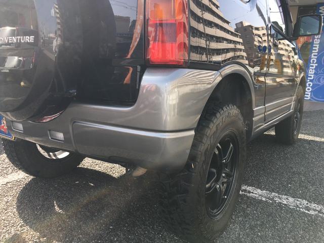 ランドベンチャー 禁煙車 4WD オフロードタイヤ ターボ ETC ナビ DVD シートヒーター ハーフレザーシート 純正16インチAW(14枚目)