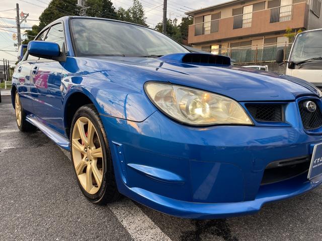 インプレッサ ＷＲＸ　５ＭＴ　ワンオーナー　アプライドモデルＧ型　タイミングベルト交換済み　大型リアウィング　ＨＩＤヘッドライト　リアフォグライト　パワーウィンドウ　純正１７インチアルミホイール　キーレスエントリー（17枚目）