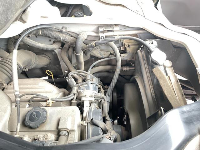 タイタンダッシュ WキャブワイドローDX 5MT 6人乗り 荷台鉄板張り 平ボディ 低床 後輪ダブルタイヤ 最大積載量1250kg 荷台サイズ 長さ210cm 幅160cm 高さ37cm 前席パワーウィンドウ エアコン フロントフォグライト(23枚目)