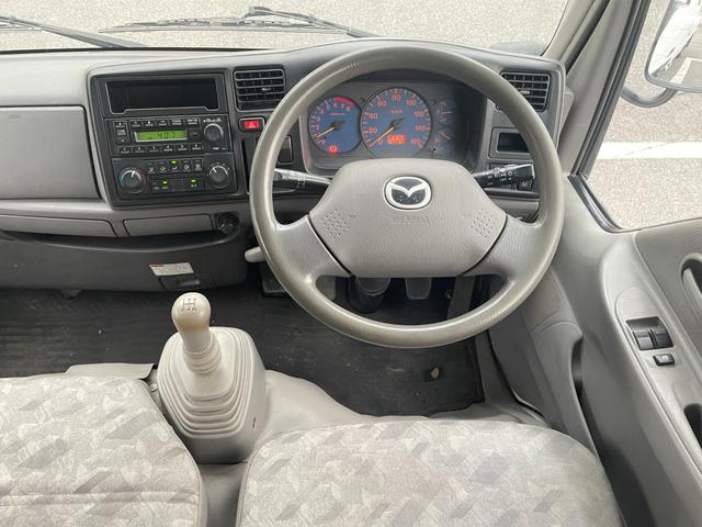 タイタンダッシュ WキャブワイドローDX 5MT 6人乗り 荷台鉄板張り 平ボディ 低床 後輪ダブルタイヤ 最大積載量1250kg 荷台サイズ 長さ210cm 幅160cm 高さ37cm 前席パワーウィンドウ エアコン フロントフォグライト(34枚目)