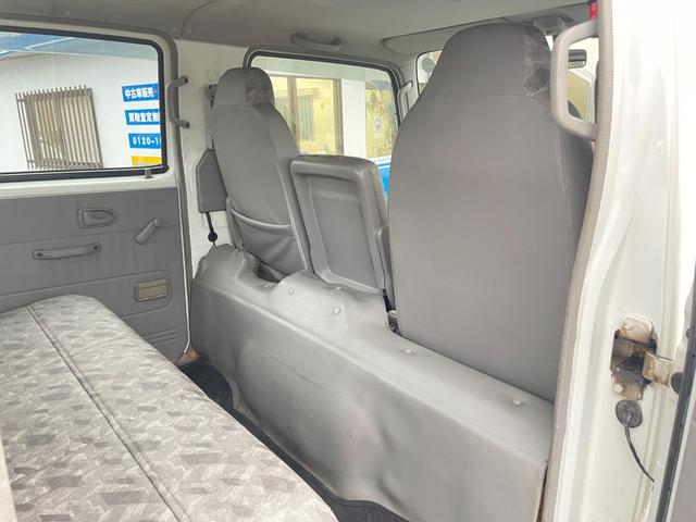タイタンダッシュ WキャブワイドローDX 5MT 6人乗り 荷台鉄板張り 平ボディ 低床 後輪ダブルタイヤ 最大積載量1250kg 荷台サイズ 長さ210cm 幅160cm 高さ37cm 前席パワーウィンドウ エアコン フロントフォグライト(58枚目)