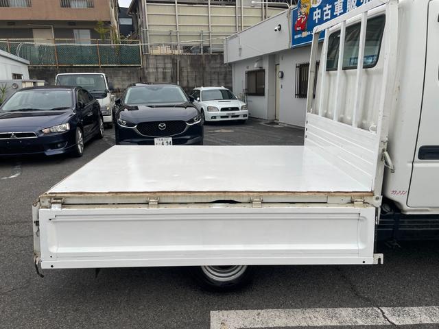 タイタンダッシュ WキャブワイドローDX 5MT 6人乗り 荷台鉄板張り 平ボディ 低床 後輪ダブルタイヤ 最大積載量1250kg 荷台サイズ 長さ210cm 幅160cm 高さ37cm 前席パワーウィンドウ エアコン フロントフォグライト(70枚目)