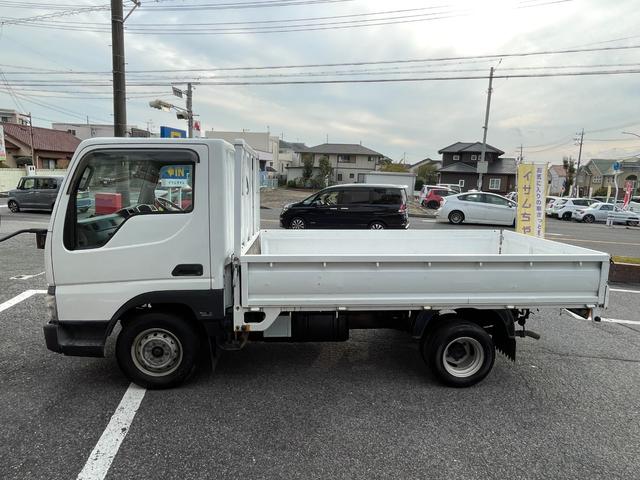 タイタンダッシュ ワイドローＤＸ　ＡＴ　ワンオーナー　平ボディ　荷台鉄板張り　低床　後輪ダブルタイヤ　最大積載量１３５０ｋｇ　荷台サイズ　長さ２８５ｃｍ　幅１６０ｃｍ　高さ３８ｃｍ　ＥＴＣ　純正オーディオ　フォグライト（10枚目）