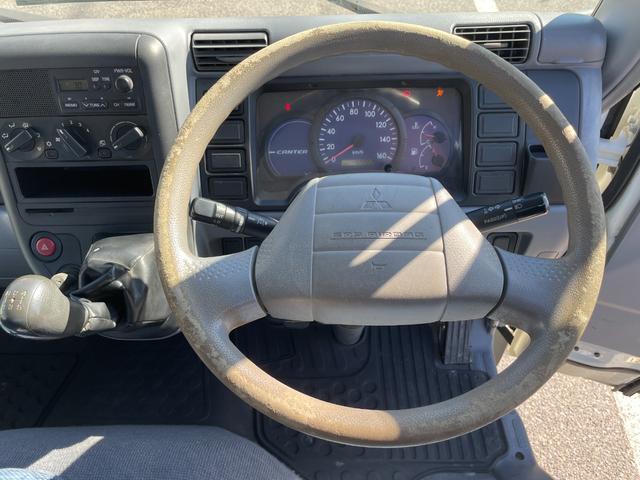 キャンターガッツ ロング全低床ＳＡ　５ＭＴ　平ボディ　荷台鉄板張り　低床　後輪ダブルタイヤ　最大積載量１５００ｋｇ　荷台サイズ　長さ３１０ｃｍ　幅１６０ｃｍ　高さ３７ｃｍ　地上高８２ｃｍ　運転席エアバック　パワーウィンドウ（31枚目）