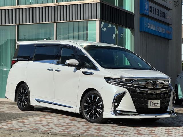 アルファードハイブリッド エグゼクティブラウンジ　モデリスタエアロ　４ＷＤ　メーカーナビ　１４型後席モニター　ＪＢＬプレミアムサウンド　左右独立ムーンルーフ　パノマミックビューモニター　トヨタメームメイト　アドバンスドパーク　寒冷地仕様　　Ｄミラー（3枚目）