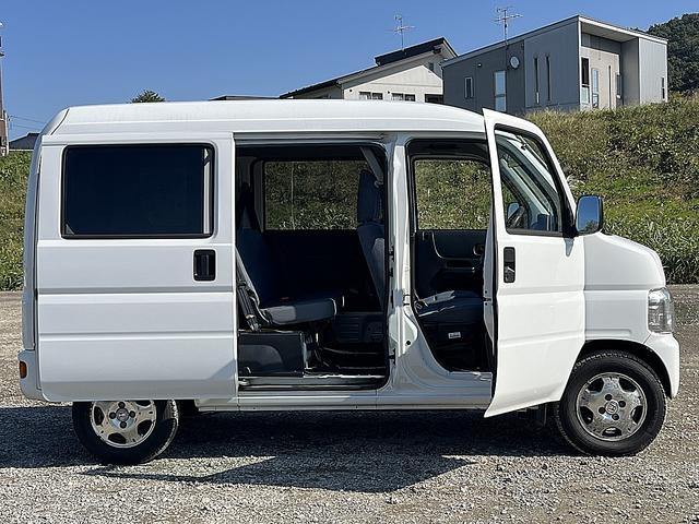 アクティバン SDX 4WD 12か月走行無制限保証付き 事業用登録可能車両 FMAMラジオ ボディ同色バンパー カーエアコン 純正アルミ ハイルーフ スペアタイヤ カップホルダー 光軸調節 手巻きウインドウ サンバイザー(35枚目)