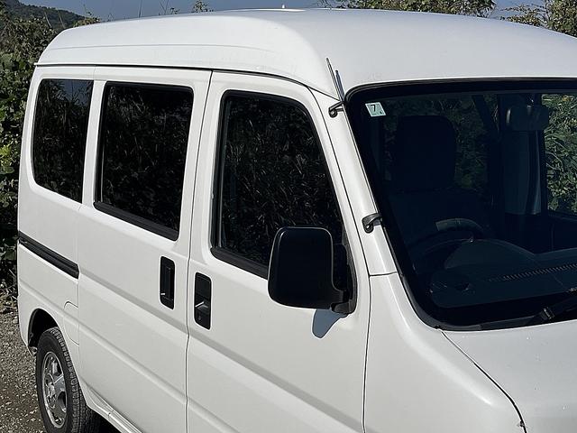 アクティバン SDX 4WD 12か月走行無制限保証付き 事業用登録可能車両 FMAMラジオ ボディ同色バンパー カーエアコン 純正アルミ ハイルーフ スペアタイヤ カップホルダー 光軸調節 手巻きウインドウ サンバイザー(49枚目)