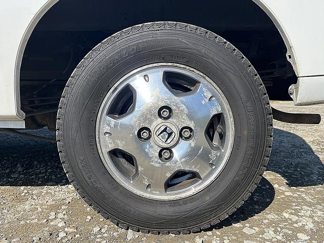 アクティバン SDX 4WD 12か月走行無制限保証付き 事業用登録可能車両 FMAMラジオ ボディ同色バンパー カーエアコン 純正アルミ ハイルーフ スペアタイヤ カップホルダー 光軸調節 手巻きウインドウ サンバイザー(65枚目)