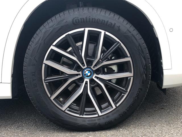 ｉＸ１ ｅＤｒｉｖｅ　２０　Ｍスポーツ　試乗車・テクノロジーＰＫＧ・１８インチＡＷ・ＡＣＣ　ＡｐｐｌｅＣａｒＰｌａｙ・ａｎｄｒｏｉｄオート・アンビエントライト・全方位カメラ・ワイヤレス充電・ＨＵＤ・オートホールド・ミラーＥＴＣ（64枚目）