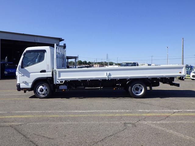 キャンター 2.9トン 平ボディー ワイド超ロング 現行モデル 10インチ液晶メーター 左右アオリバランサー 磁気サスシート 衝突軽減ブレーキ 車線逸脱警報 交通標識認識機能 バックモニター 2900kg AT(4枚目)