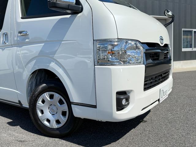 ハイエースバン 7インチナビ デジタルミラー 両側PWスライド パノラミックビュー 4WD バックカメラ TV ステアリングスイッチ 純正タイヤ プッシュスタート オートハイビーム スペアタイヤ 電動格納ミラー(14枚目)
