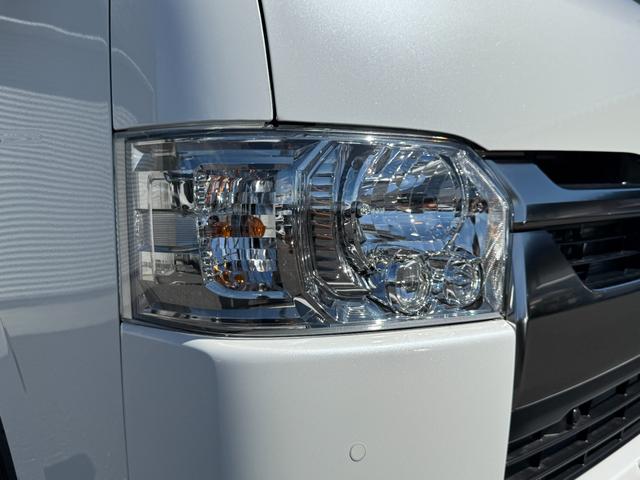 ハイエースバン 7インチナビ デジタルミラー 両側PWスライド パノラミックビュー 4WD バックカメラ TV ステアリングスイッチ 純正タイヤ プッシュスタート オートハイビーム スペアタイヤ 電動格納ミラー(21枚目)