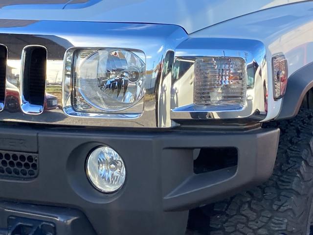 ハマーＨ３ タイプＧ　ディーラー車　右Ｈ　４ＷＤ　サンルーフ　レザーシート　社外１７ＡＷ　社外ナビ　ＴＶ　バックカメラ　サイドカメラ　ＥＴＣ　ヒッチメンバー　マッドガード　社外マフラー　シートヒーター　キーレス　記録簿あり（5枚目）
