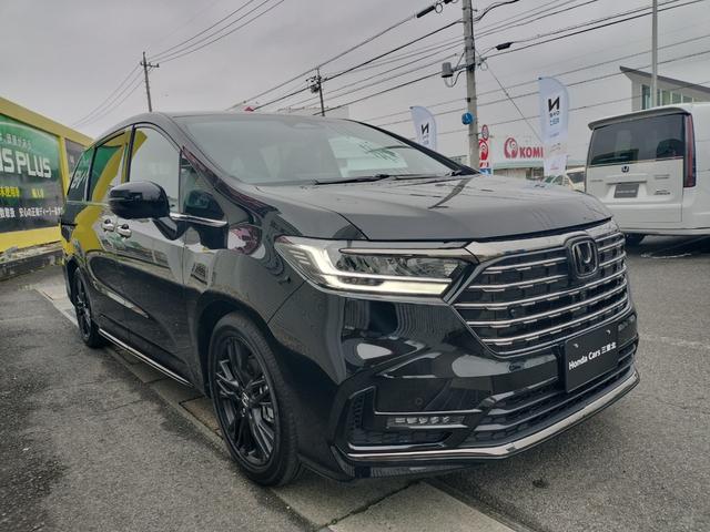 オデッセイハイブリッド ｅ：ＨＥＶアブソルート・ＥＸブラックエディション　新車　未登録車　ＥＴＣ　純正１１．４インチナビ　展示車　２列目両側アームレスト付４ウェイパワーシート　運転席＆助手席シートヒーター＋２列目シートヒーター　本革シート　１８インチアルミホイール（6枚目）