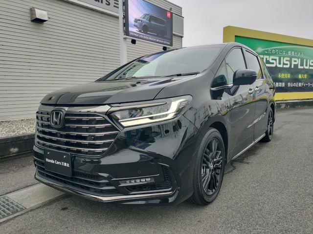 オデッセイハイブリッド ｅ：ＨＥＶアブソルート・ＥＸブラックエディション　新車　未登録車　ＥＴＣ　純正１１．４インチナビ　展示車　２列目両側アームレスト付４ウェイパワーシート　運転席＆助手席シートヒーター＋２列目シートヒーター　本革シート　１８インチアルミホイール（8枚目）