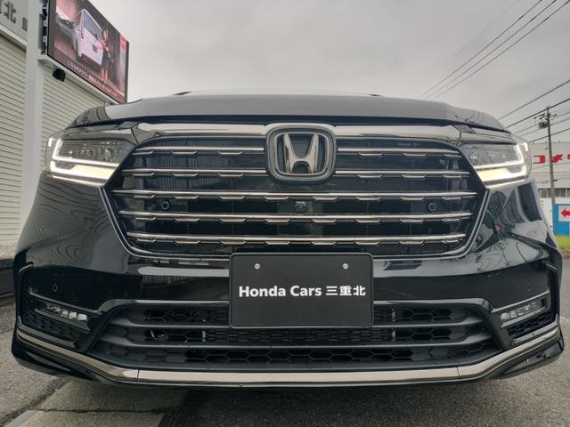 オデッセイハイブリッド ｅ：ＨＥＶアブソルート・ＥＸブラックエディション　新車　未登録車　ＥＴＣ　純正１１．４インチナビ　展示車　２列目両側アームレスト付４ウェイパワーシート　運転席＆助手席シートヒーター＋２列目シートヒーター　本革シート　１８インチアルミホイール（49枚目）