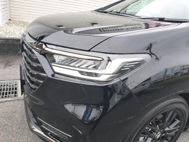オデッセイハイブリッド ｅ：ＨＥＶアブソルート・ＥＸブラックエディション　新車　未登録車　ＥＴＣ　純正１１．４インチナビ　展示車　２列目両側アームレスト付４ウェイパワーシート　運転席＆助手席シートヒーター＋２列目シートヒーター　本革シート　１８インチアルミホイール（50枚目）