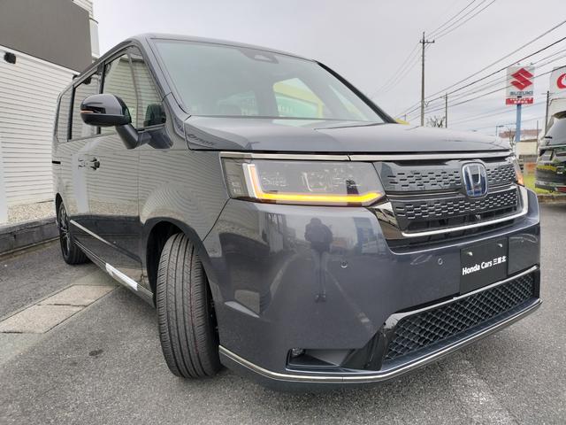 ステップワゴン eHEVスパーダプレミアムラインブラックエディション 新車 未登録車 展示車 オーディオレス マルチビューカメラシステム運転席&助手席&2列目シートヒーター 二列目オットマン コンビシート プレミアムラインブラックエディション(5枚目)