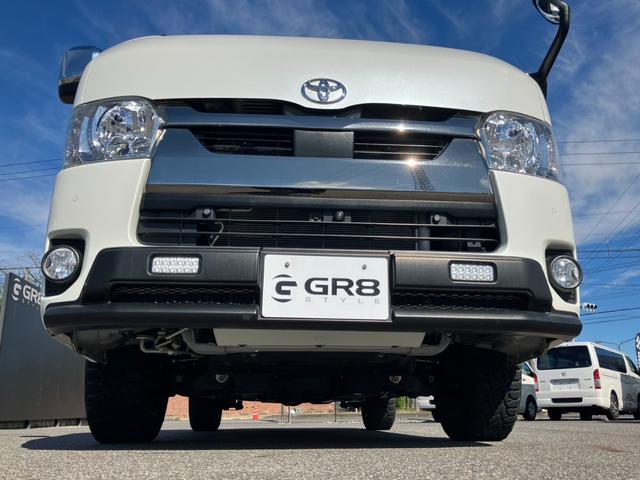 ハイエースバン スーパーＧＬ　ダークプライムＩＩ　４ＷＤ／寒冷地仕様／ナビＴＶ／バックカメラ／ＥＴＣ／パノラミックビューモニター／デジタルインナーミラー／フロントスポイラー／１６ｉｎアルミ／シートカバー／ＬＥＤヘッドライト／床張りキット／ベッドキット（30枚目）