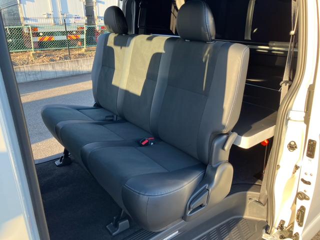 ハイエースバン スーパーＧＬ　ダークプライムＩＩ　１オーナー／ナビＴＶ／バックカメラ／ＥＴＣ／パノラミックビューモニター／デジタルインナーミラー／インナーブラックヘッドライト／フロントスポイラー／ＡＣ１００Ｖ電源／１８ｉｎアルミ／ベッドキット（63枚目）