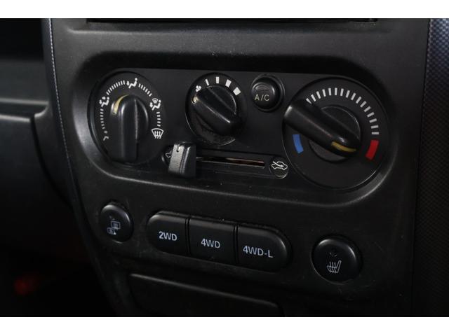 ジムニー ワイルドウインド 禁煙/レザーシート/シートヒーター/革巻きステアリングホイール/純正16AW/ルーフレール/フロントフォグランプ/ボディ同色背面ハードカバー/プライバシーガラス/キーレスエントリー/当店直接買取(21枚目)