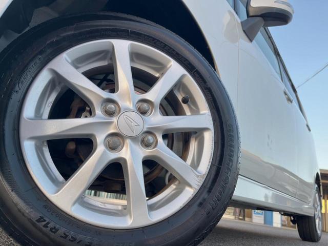 ムーヴ カスタム Xリミテッド 純正SDナビ バックカメラ 禁煙車 スマートキー HIDヘッド ETC オートエアコン 純正14インチアルミ CD 地デジ シートリフター 電動格納ミラー アームレスト アイドリングストップ(14枚目)