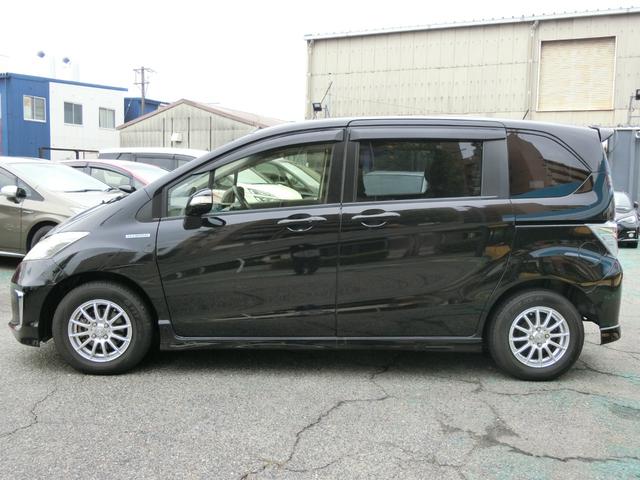 フリードハイブリッド ハイブリッド プレミアムエディション プレミア故障保証ゴールド1年付 両側パワースライドドア 純正ナビ フルセグ BT Bカメラ 純正FDモニター ハーフレザーシート 革巻ステアリング スマートキー2個 ETC HIDヘッドライト(9枚目)