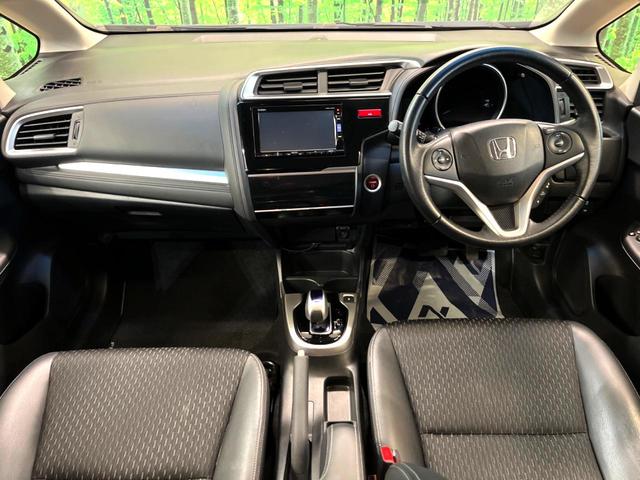 フィットハイブリッド Ｌパッケージ　純正ナビ　バックカメラ　衝突被害軽減システム　禁煙車　ハーフレザーシート　ドラレコ　スマートキー　ＬＥＤヘッド　ビルトインＥＴＣ　クルコン　オートライト　オートエアコン　Ｂｌｕｅｔｏｏｔｈ　ＣＤ（2枚目）