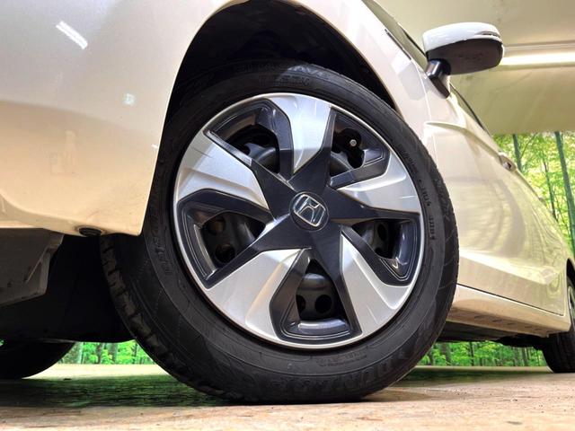 フィットハイブリッド Ｌパッケージ　純正ナビ　バックカメラ　衝突被害軽減システム　禁煙車　ハーフレザーシート　ドラレコ　スマートキー　ＬＥＤヘッド　ビルトインＥＴＣ　クルコン　オートライト　オートエアコン　Ｂｌｕｅｔｏｏｔｈ　ＣＤ（14枚目）