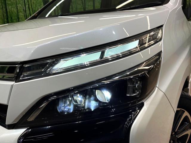 ヴォクシー ZS 煌 純正10型ナビ 後席モニター 両側電動スライド トヨタセーフティセンス クルーズコントロール 衝突軽減 車線逸脱防止 クリアランスソナー バックカメラ ETC LEDヘッドライト 本革巻きステアリング(15枚目)