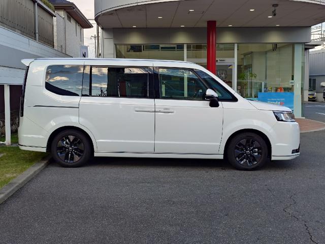 ステップワゴン e:HEVスパーダ 当店試乗車 ETC11インチナビ 10インチリアモニター クリアランスソナー オートクルーズコントロール 衝突被害軽減システム 両側電動スライドドア LEDヘッドランプ 電動リアゲート シートヒーター(12枚目)