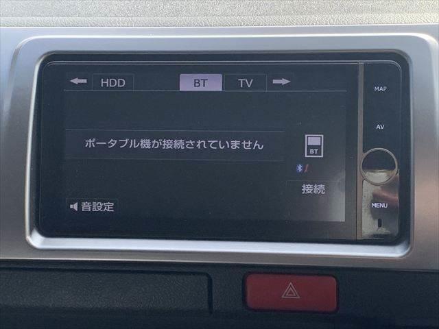ハイエースバン ロングスーパーＧＬ　純正ＨＤＤナビ　Ｂｌｕｅｔｏｏｔｈ　地デジＴＶ　バックカメラ　両側スライドドア　禁煙車　ＥＴＣ　盗難防止装置　キーレスエントリー　電動格納ミラー　純正１５インチアルミホイール　パワーウィンドウ（5枚目）