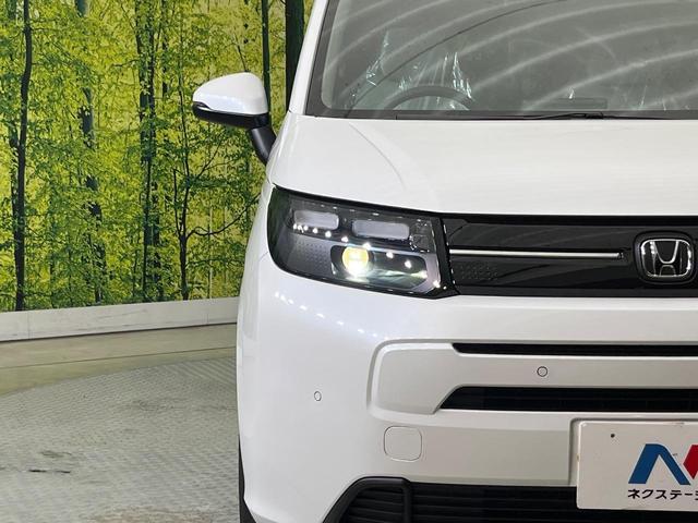 フリード エアー 登録済未使用車 両側電動ドア バックカメラ ホンダセンシング アダプティブクルーズ コーナーセンサー スマートキー LEDヘッド 純正8型ディスプレイオーディオ オートハイビーム 車線逸脱警報(29枚目)