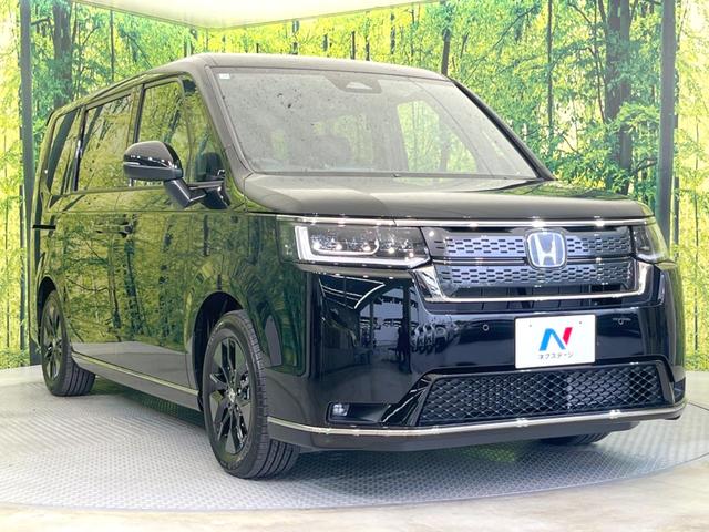 ステップワゴン e:HEVスパーダ 登録済未使用車 両側電動ドア 純正SDナビ 衝突被害軽減システム レーダークルーズ バックカメラ 電動リアゲート ハーフレザーシート コーナーセンサー LEDヘッド 車線逸脱警報 スマートキー(17枚目)