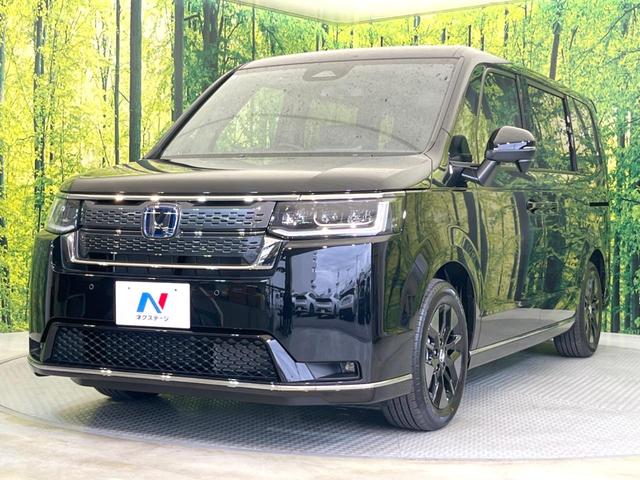 ステップワゴン e:HEVスパーダ 登録済未使用車 両側電動ドア 純正SDナビ 衝突被害軽減システム レーダークルーズ バックカメラ 電動リアゲート ハーフレザーシート コーナーセンサー LEDヘッド 車線逸脱警報 スマートキー(28枚目)