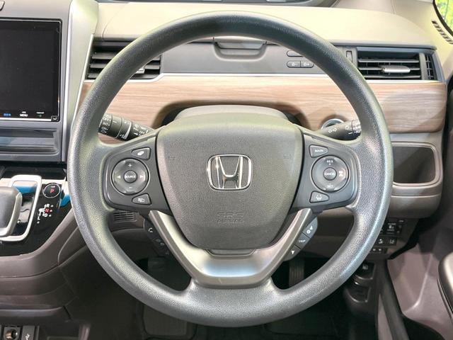 フリードハイブリッド ハイブリッド・Ｇホンダセンシング　両側電動ドア　純正９型ナビ　バックカメラ　衝突被害軽減システム　レーダークルーズ　禁煙車　ドラレコ　スマートキー　ＬＥＤヘッド　ＥＴＣ　車線逸脱警報　オートライト　オートエアコン　Ｂｌｕｅｔｏｏｔｈ（12枚目）