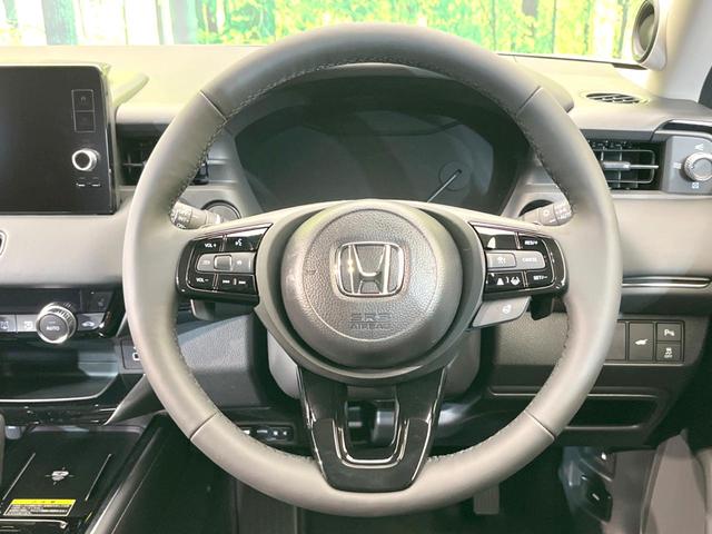 ヴェゼル ｅ：ＨＥＶ　Ｚ　登録済未使用車　純正９インチナビ　全周囲カメラ　ＥＴＣ２．０　ホンダセンシング　レーダークルーズ　パワーバックドア　Ｂｌｕｅｔｏｏｔｈ　ブラインドスポットモニター　前席シートヒーター（11枚目）