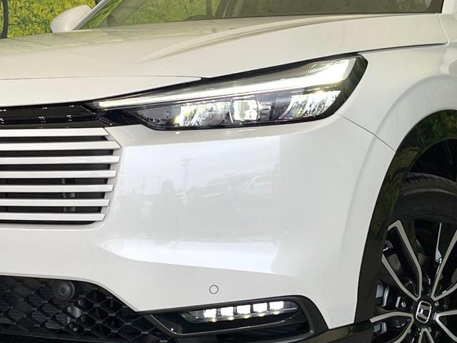 ヴェゼル ｅ：ＨＥＶ　Ｚ　登録済未使用車　純正９インチナビ　全周囲カメラ　ＥＴＣ２．０　ホンダセンシング　レーダークルーズ　パワーバックドア　Ｂｌｕｅｔｏｏｔｈ　ブラインドスポットモニター　前席シートヒーター（12枚目）