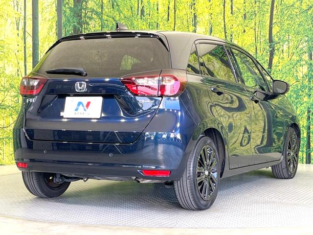 フィット ｅ：ＨＥＶホーム　２０周年特別仕様車　カーサ　衝突被害軽減システム　レーダークルーズ　ＬＥＤヘッド　ＥＴＣ２．０　純正１６インチアルミ　オートハイビーム　車線逸脱警報　コーナーセンサー　スマートキー　バックカメラ　オートライト　オートエアコン（18枚目）