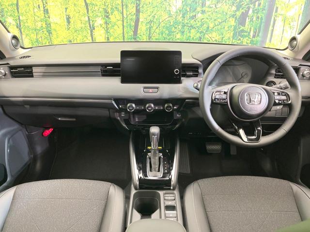 ヴェゼル ｅ：ＨＥＶ　Ｚ　登録済未使用車　純正９型ナビ　全周囲カメラ　ＥＴＣ　衝突軽減　レーダークルーズコントロール　ＢＳＭ　パワーバックドア　シートヒーター　オートエアコン　プッシュスタート（2枚目）