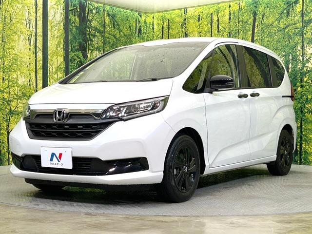 フリードハイブリッド ハイブリッド・Ｇブラックスタイル　両側電動ドア　純正ＳＤナビ　バックカメラ　衝突被害軽減システム　禁煙車　ドラレコ　スマートキー　ＬＥＤヘッド　ビルトインＥＴＣ　純正１５インチアルミ　車線逸脱警報　オートライト　オートエアコン（21枚目）