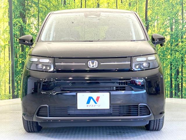 フリード ｅ：ＨＥＶエアー　ＥＸ　登録済未使用車　両側電動スライドドア　アダプティブクルーズコントロール　前席シートヒーター　ＬＥＤヘッドライト　スマートキー　オートライト　オートエアコン　ブラインドスポットモニター（15枚目）