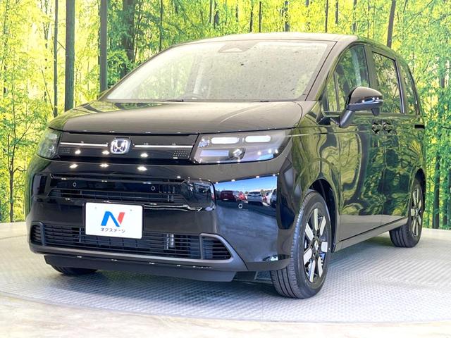 フリード ｅ：ＨＥＶエアー　ＥＸ　登録済未使用車　両側電動スライドドア　アダプティブクルーズコントロール　前席シートヒーター　ＬＥＤヘッドライト　スマートキー　オートライト　オートエアコン　ブラインドスポットモニター（22枚目）