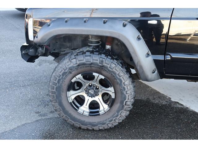 ジープ・チェロキー リミテッド　リフトアップ　１８インチＡＷ＆Ｍ／Ｔタイヤ　社外オーバーフェンダー　赤／白テール　パナソニック２ＤＩＮナビ＆バックカメラ　前後ドラレコ　ＥＴＣ　バイパーキーレス　エンジンルームＰＣＭリビルト済　下取（21枚目）