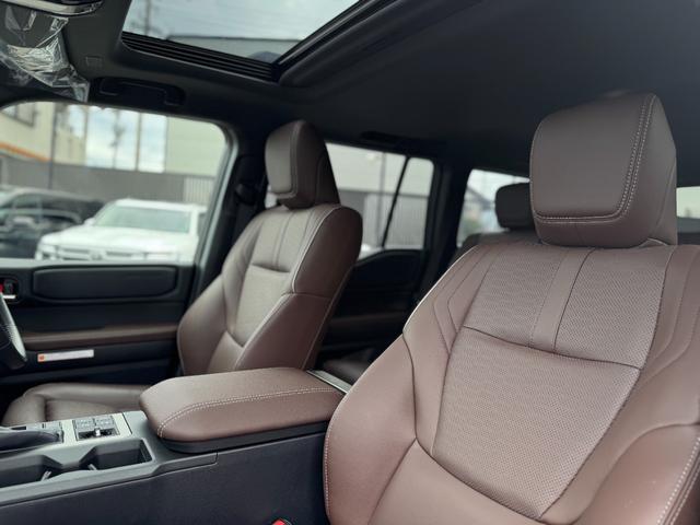 ランドクルーザー250 ZX JBLサウンド 丸目ヘッドライト ムーンルーフ ルーフレール パノラミックビューモニター フルセグTV 純正12.3型ナビ デジタルインナーミラー シートエアコン 電動格納サードシート ワイヤレス充電(26枚目)